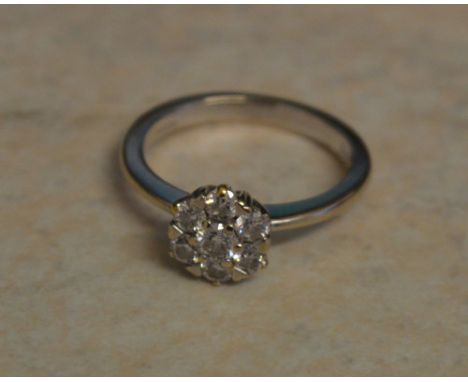18ct white gold diamond daisy ring, approx 0.5ct of diamonds total, Ring Size J/K