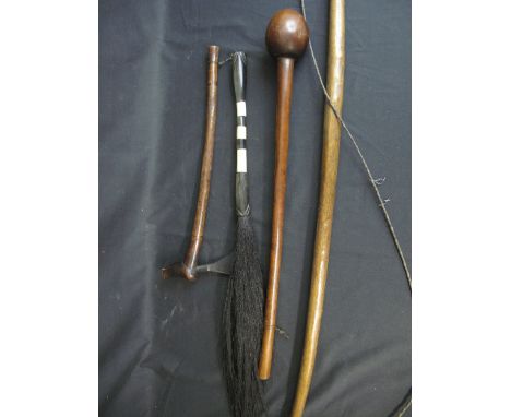 GROUP OF AFRICAN TRIBAL WEAPONS and artifacts to include knobkerry, iron axe with rustic wooden handle, horn and ivory fly sw