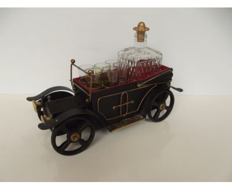 Novelty musical decanter set in the form of a vintage car 