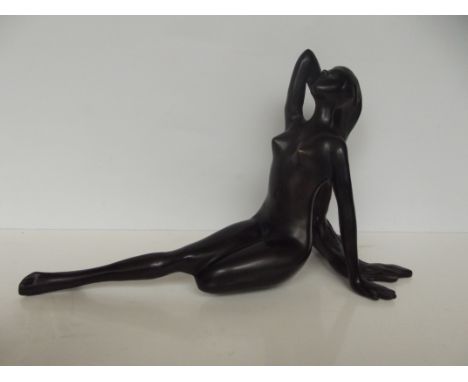 Bronze figure of a recumbent lady, length 40cm 