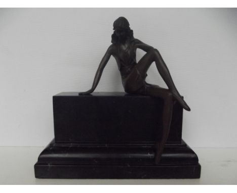 Bronze figure of a seated lady on a marble plinth, height 20cm , length 20cm 