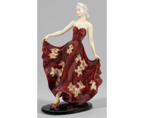Goldscheider-Figur "Phantasie". Originaltitel Steingut. Auf einer ovalen, schwarz staffierten Plinthe schreitende junge Dame 