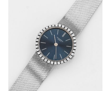 Damenarmbanduhr von IWC Weißgold, gest. 750. Rundes Uhrengehäuse umlaufend besetzt mit Diamanten. Nachtblaues Zifferblatt im 
