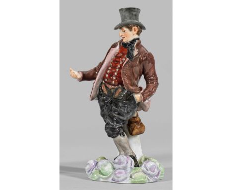 Trachtenfigur "Vierländer Bauer" Runder, reliefierter Pflasterterrain-Sockel, belegt mit plastischen Kohlköpfen. An einem Gre