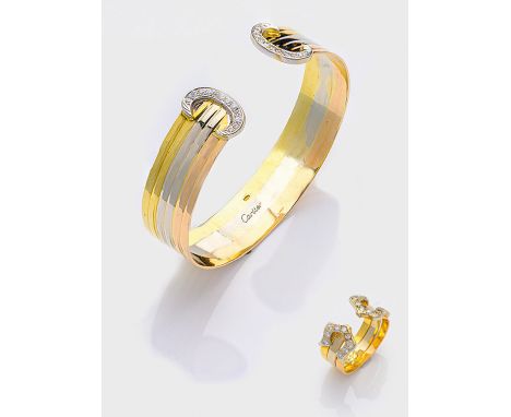 Demi Parure im Stil von Cartier der 90er Jahre Sog. "Manschetten-Armspange" mit korrespondierendem Ring. Gelb-, Weiß- und Ros