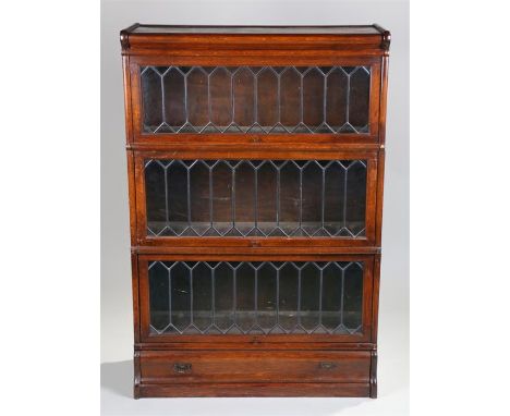 Globe Wernicke style sectional oak bookcase, the rectangular top above three astragal glazed sections and drawer to the base,