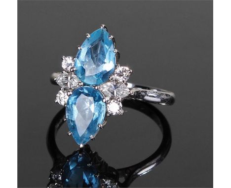 18 carat white gold aquamarine and diamond set ring with two pear cut aquamarines, two marquise cut diamonds and four round b