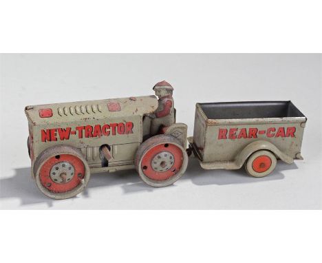 Tinplate clockwork toy of a New-Tractor and Rear-Car, in grey with red lettering, 15cm long