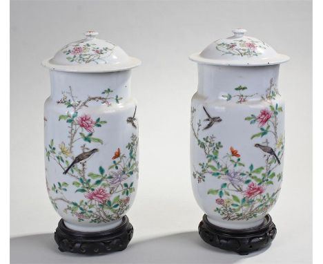 Pair of Chinese porcelain vases and covers, the covers with flower decorated enamels and shaped bodies, enamel birds flying a