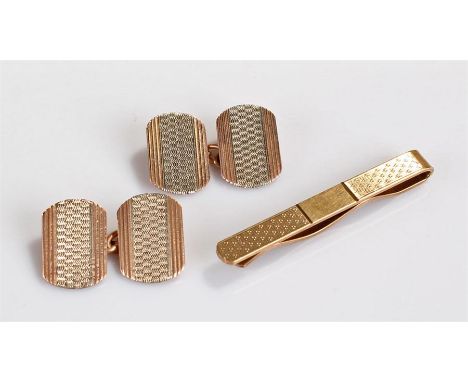 Pair of 9 carat gold cufflinks and tie clip, the cufflinks with white metal centre, line decoration to the edge, together wit
