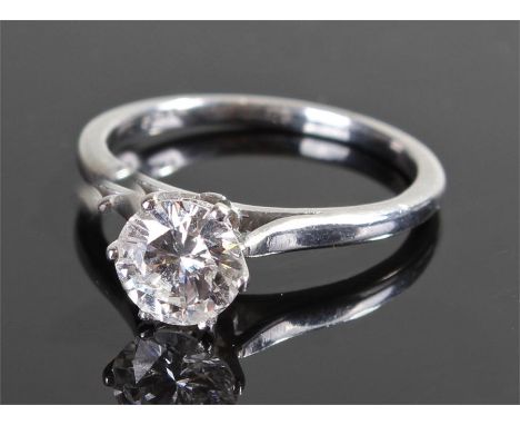 Fine platinum and diamond set solitaire ring, the round cut diamond at approximately 1.3 carats set on a high six claw mount,