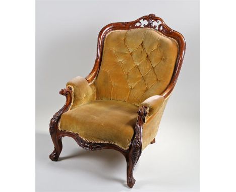 Victorian oak button back armchair, the angled back with scroll show wood frame, deep stuff over seat and carved carbiole leg