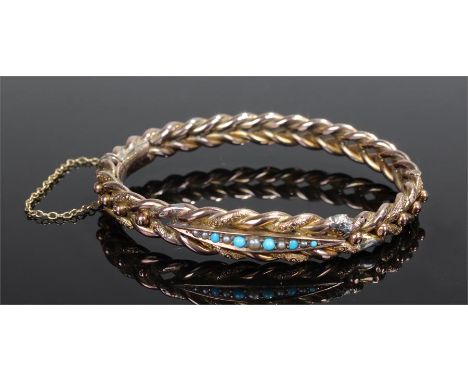 Victorian turquoise and seed pearl bangle, the central row of stones set within a Wrythen 9 carat gold bangle