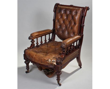 Fine Victorian mahogany and leather upholstered armchair. The bar scroll back with a tan leather, button back, stuff over bac