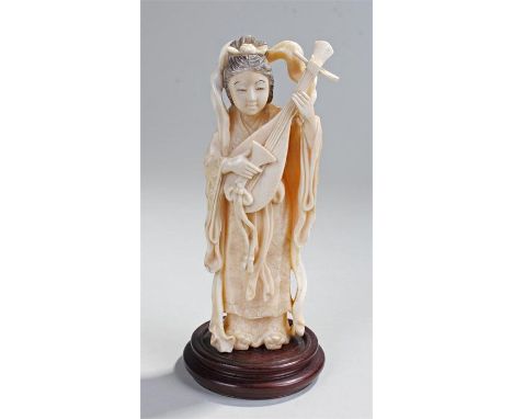 Early 20th Century ivory okimono, carved as a lady playing the lute, 16cm high