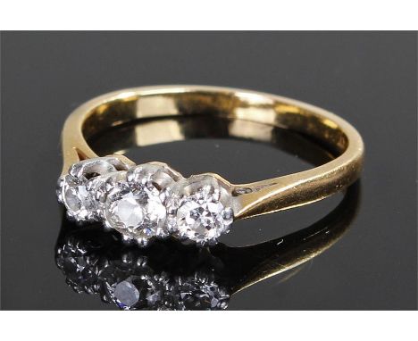 18 carat gold diamond ring, the ring set with three diamonds to the platinum head, ring size P 