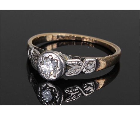 18 carat gold diamond set ring, the diamond set in platinum with foliate platinum shoulders, ring size M