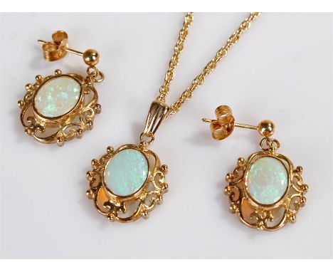 9 carat gold and opal jewellery set, consisting of a pair of earrings with oval opals and a conforming pendant with necklace,