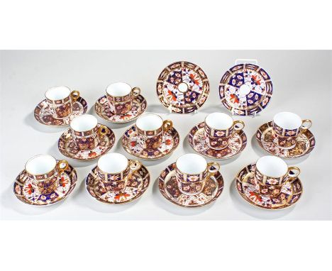 Set of six Royal Crown Derby coffee cups and saucers, decorated with blue, red and gilt decoration, together with a set of fo