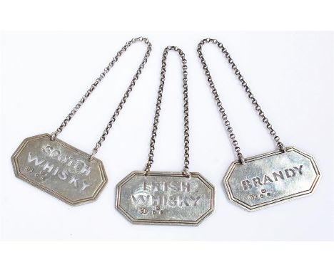 Victorian silver bottle labels, London 1898, maker Charles Boyton & Son, consisting of Brandy, Scotch Whisky and Irish Whisky