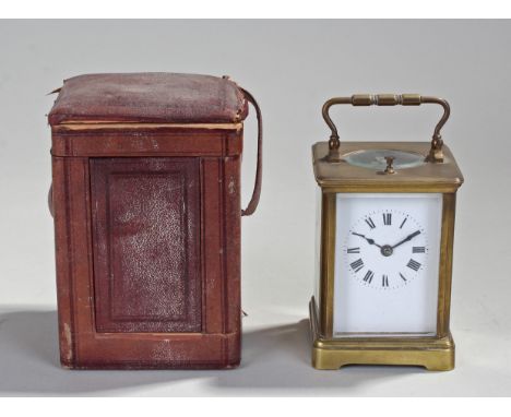 French gilt brass carriage clock, the corniche case with glass top, sides, front and back, white enamel dial with Roman hours