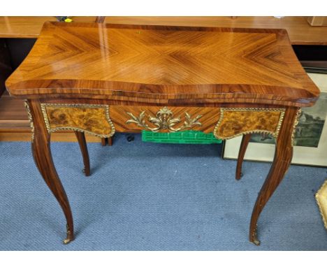 A modern Louis XVI style kingwood and mahogany finished card table with metal mounts, on cabriole legs, 76cm h x 84.5cm wLoca