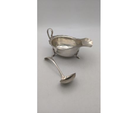 A viner silver sauce boat on three feet and small sauce ladle, both hallmarked Sheffield 1932, total weight 138gLocation:If t