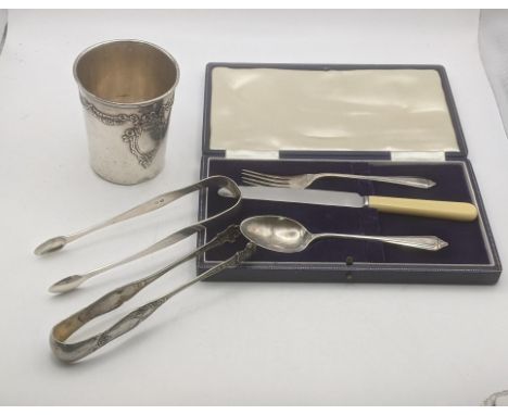A group of mixed silver to include 19th/early 20th century French goblet together with two pairs of sugar tongs, a silver tea