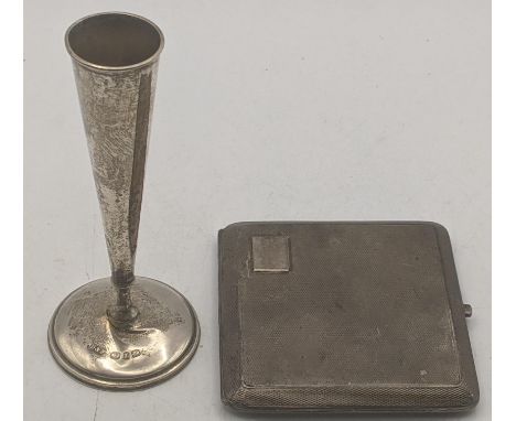 A silver Cohen and Charles engine turned cigarette case having gilt interior, hallmarked Chester 1926 together with a small v