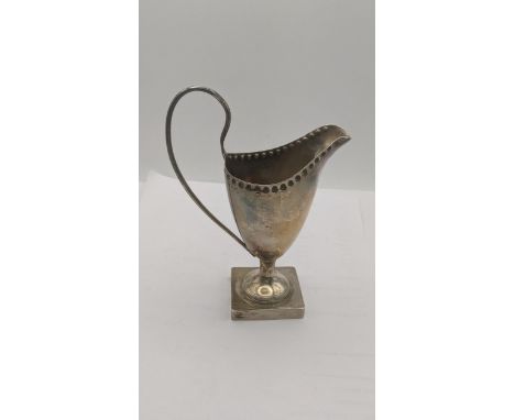 A silver helmet shaped jug on a square pedestal base, 120.5gLocation:If there is no condition report, please request.