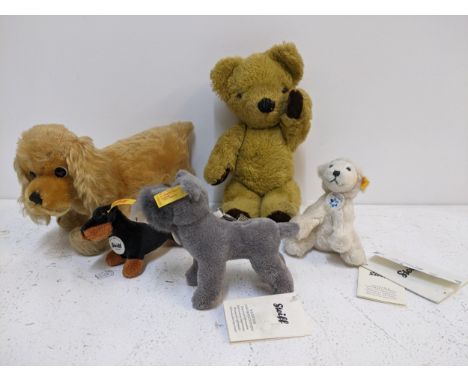 Group of soft toys to include a Steiff dog and three keyrings, and a Merrythought bear Location:If there is no condition repo