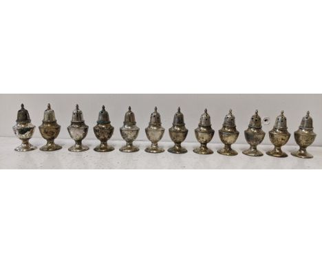 Twelve Chinese silver salts and peppers, stamped Hong Kong Sterling to the base, 124.8gLocation:If there is no condition repo