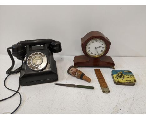 A vintage 1950s 164-56 black and Bakelite dial phone model 332L with base drawer, a mahogany mantel clock with French movemen