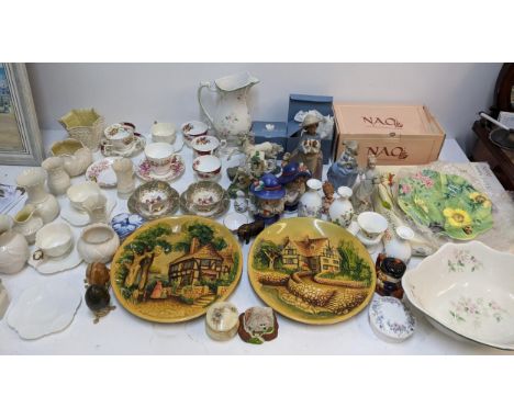 A mixed lot of ceramics to include a Nao by Lladro figure called 'A Girl Holding Two Puppies', a Wedgwood 'Angela' pattern dr