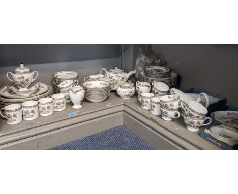 An eight piece Wedgwood Kutani Crane pattern dinner service to include dinner plates, bowls, teapot, cups, saucers, gravy/sau