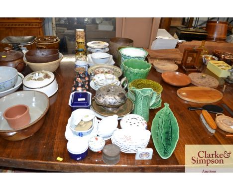 A large quantity of various china to include green leaf glazed plates, jardinieres, a brass planter, plated teapot etc.