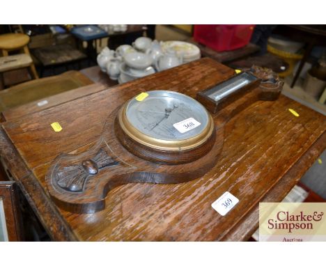 An oak cased barometer thermometer 