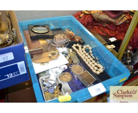 A box containing various costume jewellery, a Wade trinket box, travel inkwell, decanter label, £5 coin etc.