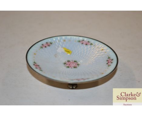 A small silver and enamel decorated pin dish