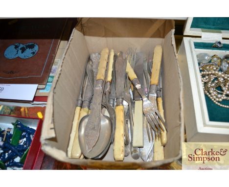 A box containing silver plated cutlery 