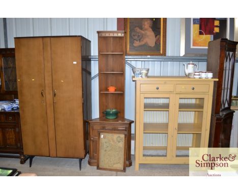 An Ercol corner cupboard 