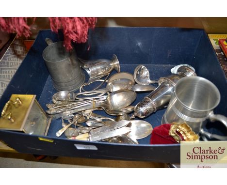 A box containing various silver plated ware