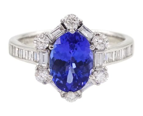 18ct white gold tanzanite and diamond cluster ring, oval tanzanite, with baguette and round brilliant cut diamond surround an