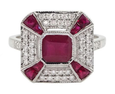 White gold ruby and diamond cluster ring, the central emerald cut ruby, with round brilliant cut diamond and calibre cut ruby