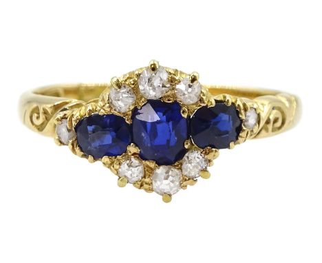 Victorian 18ct gold sapphire and diamond cluster ring, with engraved scroll design shoulders, Birmingham 1896Condition Report