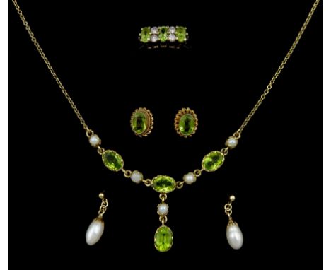 Gold peridot and pearl necklace, pair of peridot stud earrings, peridot and diamond ring and a pair of pearl earrings, all 9c