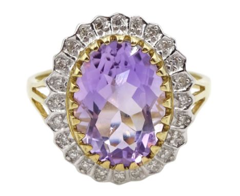 9ct gold oval amethyst and diamond cluster ring, hallmarkedCondition Report:Approx 5gm, size W-X, overall head = 19mmx16mm 