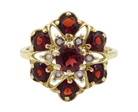 9ct gold garnet and diamond flower head cluster ring, hallmarked Condition Report:Approx 2.8gm, size O, overall head = 16.5mm