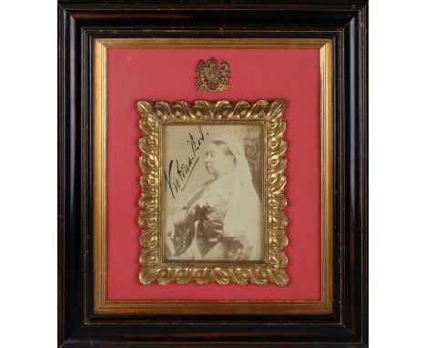 AUTOGRAPH, QUEEN VICTORIA. An albumen-print photograph of Queen Victoria, signed in black ink, 13.5cm x 9.5cm, within a carve