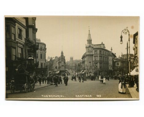 A collection of approximately 68 postcards of East Sussex, including photographic postcards titled 'The Memorial, Hastings', 